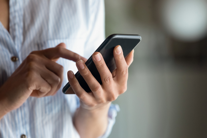 woman scrolling on phone